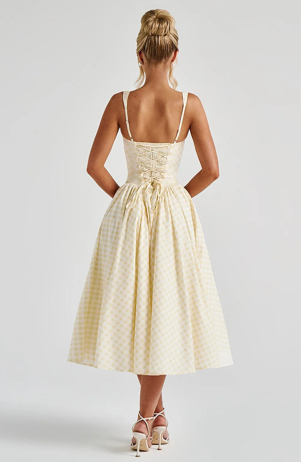 Back view of cream gingham midi dress with lace-up corset bodice