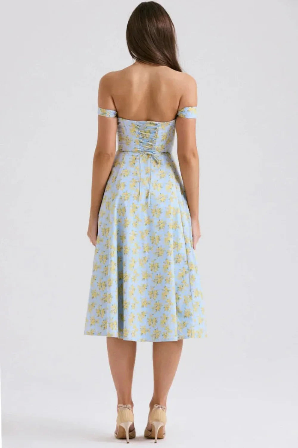 Back view of a blue floral off shoulder midi dress with ruched back and midi length
