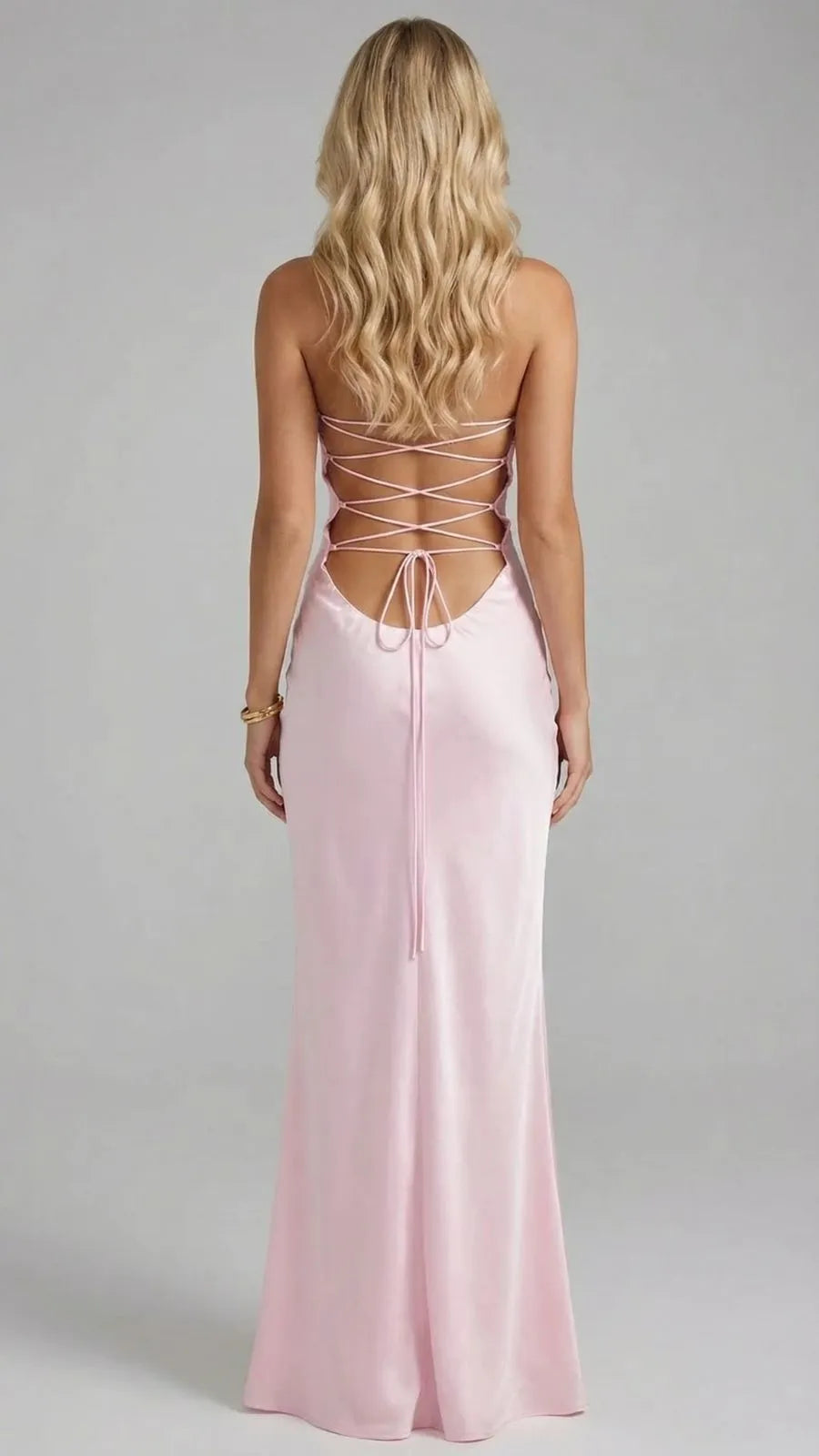 Rear view of pink spaghetti strap maxi dress with crisscross back lacing