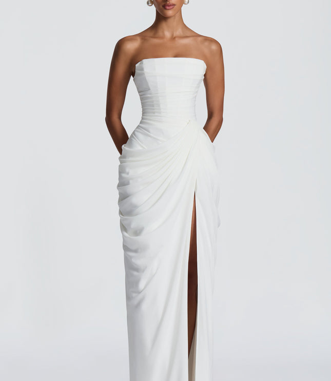 White strapless corset womens dress with ruched bodice and thigh split maxi skirt front view