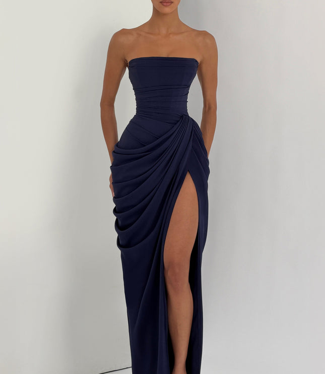 Navy strapless corset maxi womens dress in studio corner, ruched drape and high thigh split skirt