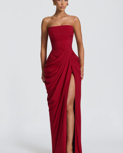 Deep red strapless corset maxi womens dress with asymmetric draped skirt and thigh-high slit