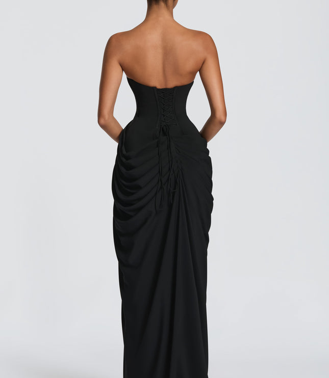Black maxi dress with strapless corset bodice and high thigh split in front view