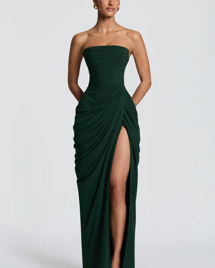 Black strapless maxi dress with thigh split and flowing drape, front angle view
