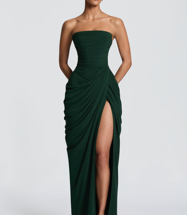 Black strapless maxi dress with thigh split and flowing drape, front angle view