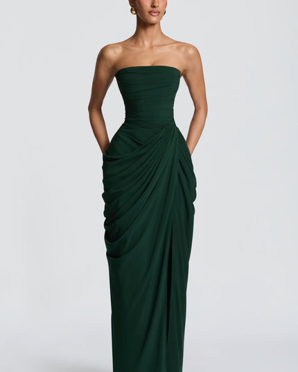 Back view of dark green strapless maxi dress with corset lacing and long skirt
