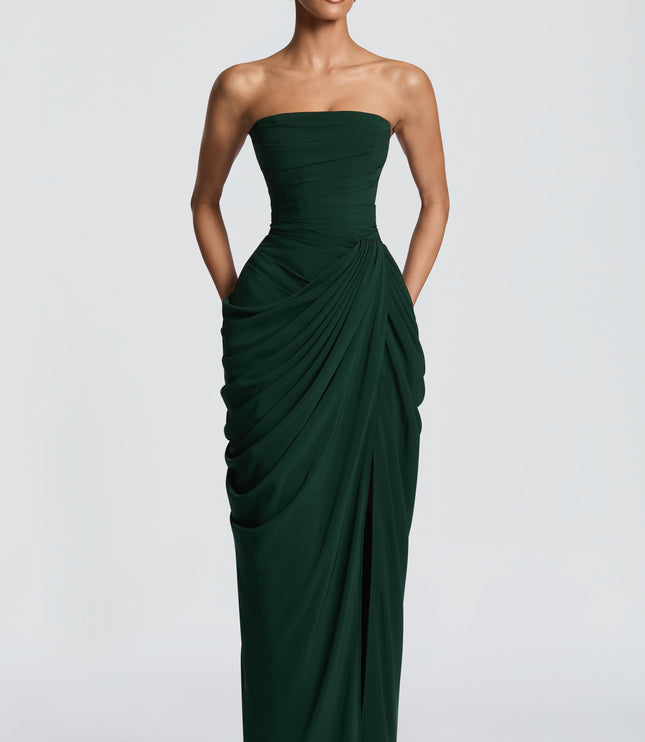 Back view of dark green strapless maxi dress with corset lacing and long skirt
