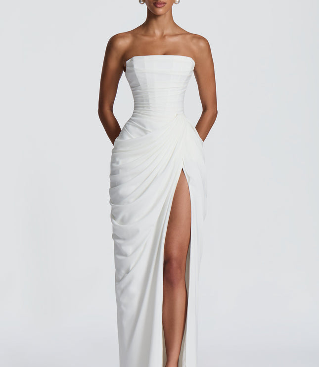 White strapless corset maxi womens dress with draped skirt and thigh split, front view