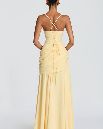 Back view of butter yellow square neck maxi dress with crisscross straps and lace-up detail