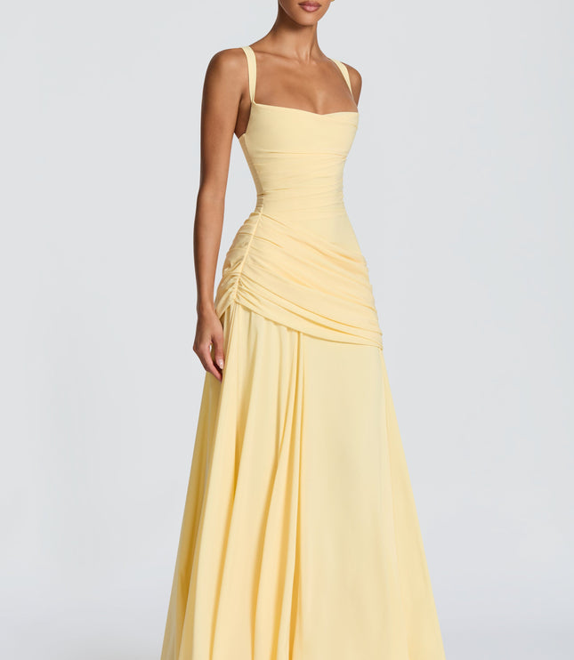 Side angle butter yellow square neck womens dress with ruched hip and draped maxi skirt