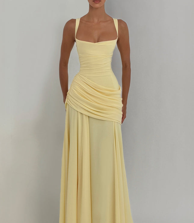 Butter yellow square neck maxi dress in natural lighting, ruched waist and flowing skirt front