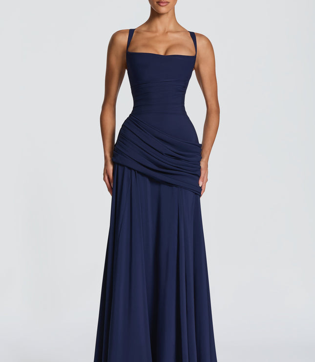 Navy blue square neck wedding guest maxi dress with ruched waist and draped skirt, front view