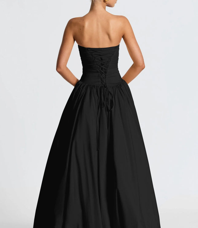 Back view black strapless high low maxi dress with lace-up corset detail and long skirt