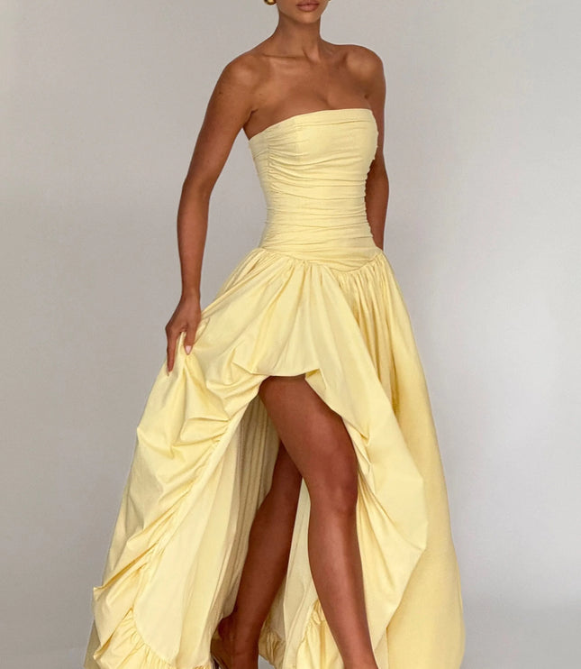 Studio front view pale yellow strapless high low maxi dress with gathered skirt and high slit