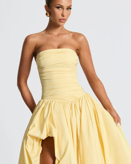 Upper body view pale yellow strapless maxi cocktail dress with ruched bodice and puffed skirt