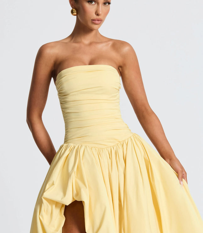 Upper body view pale yellow strapless maxi cocktail dress with ruched bodice and puffed skirt