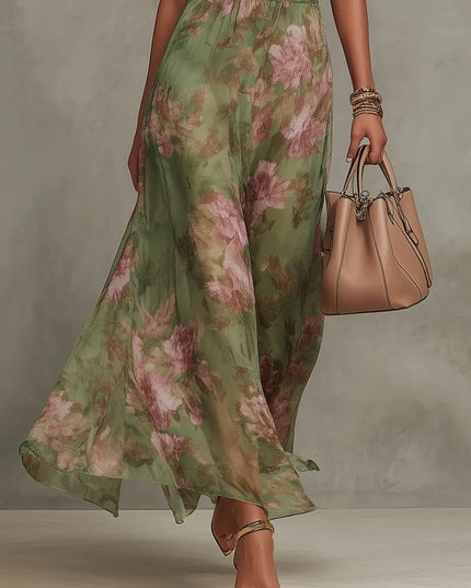 Women green floral maxi dress showing flowing skirt drape and ankle-length hem with halter neckline