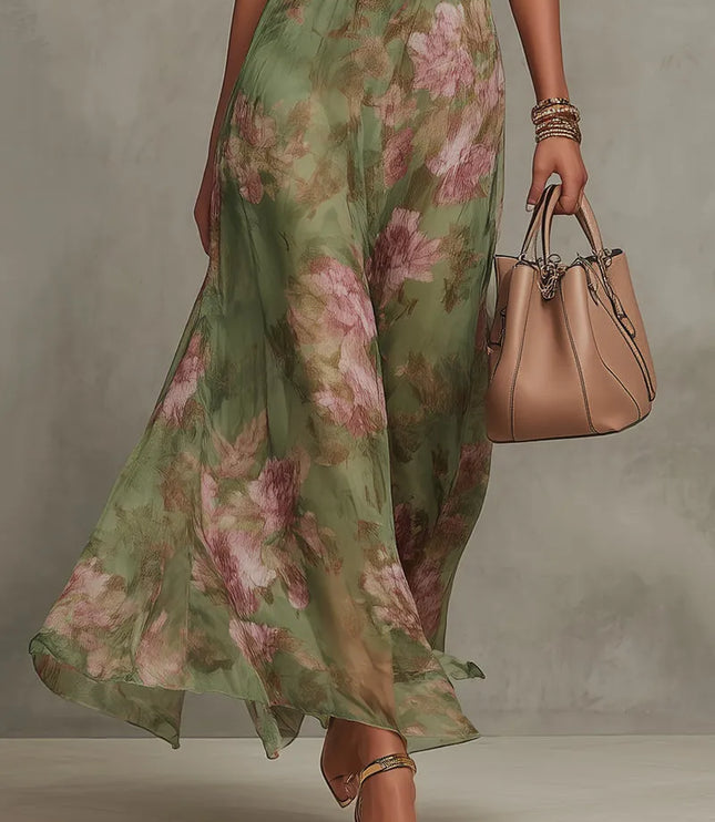 Women green floral maxi dress showing flowing skirt drape and ankle-length hem with halter neckline