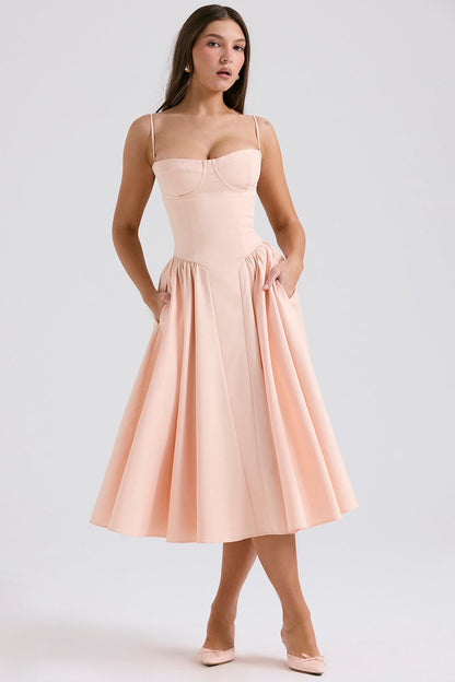 Blush pink cocktail midi dress with adjustable straps, structured cups, and side pockets