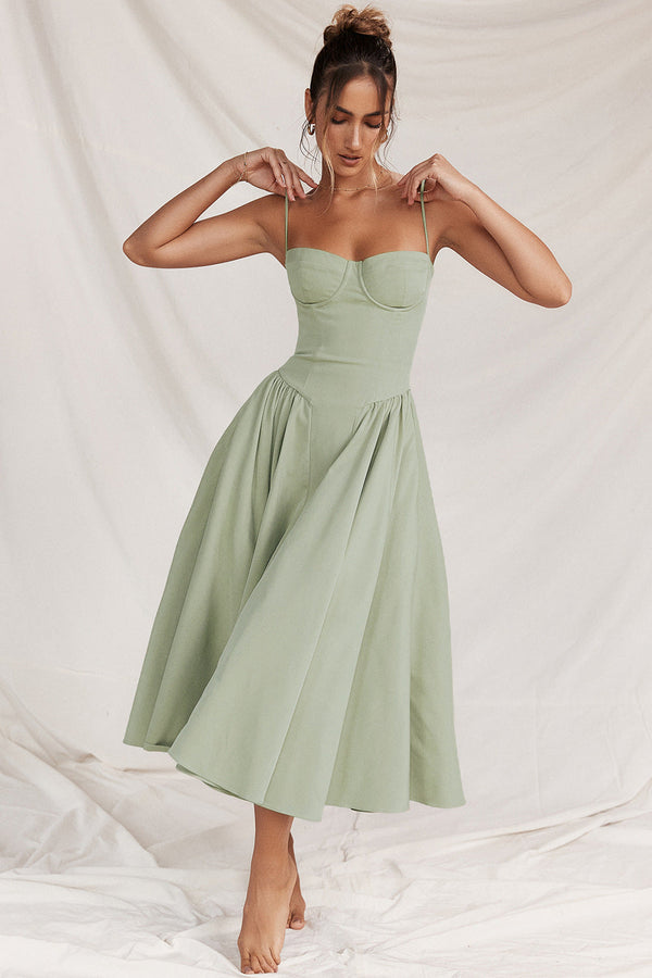 Light green cocktail midi dress with adjustable straps, corset bodice, and full skirt