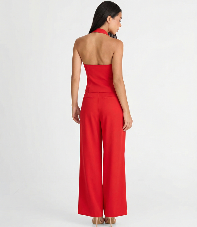 Back view of red halter wide leg pants set showing open back vest top and full-length trousers