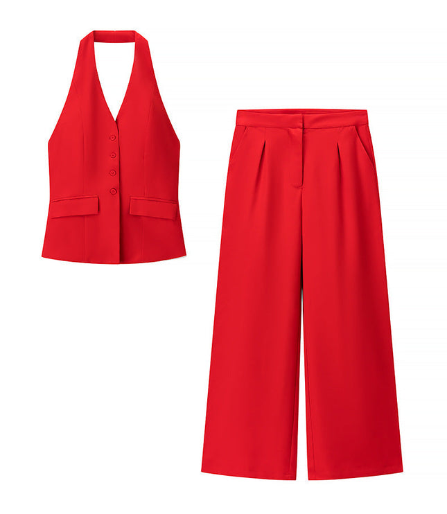 Two-piece red halter top and wide leg pants set laid flat on white background