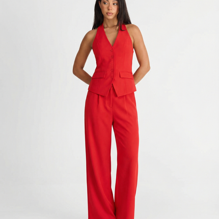 Red halter wide leg pants set with tailored vest top and flowing trousers on model