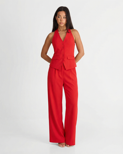 Red halter wide leg pants set with tailored vest top and flowing trousers on model