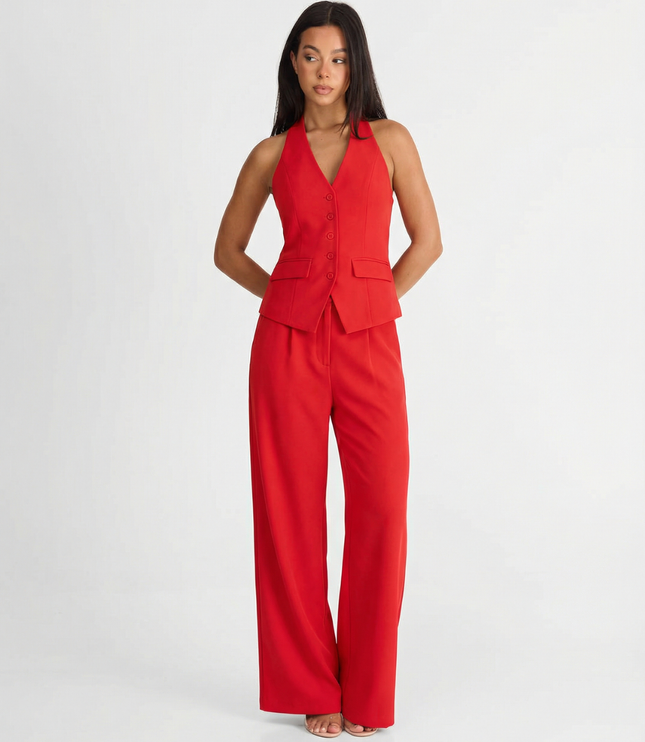 Red halter wide leg pants set with tailored vest top and flowing trousers on model