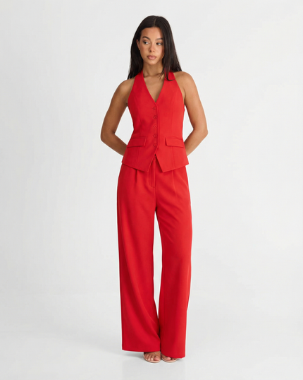 Red halter wide leg pants set with tailored vest top and flowing trousers on model