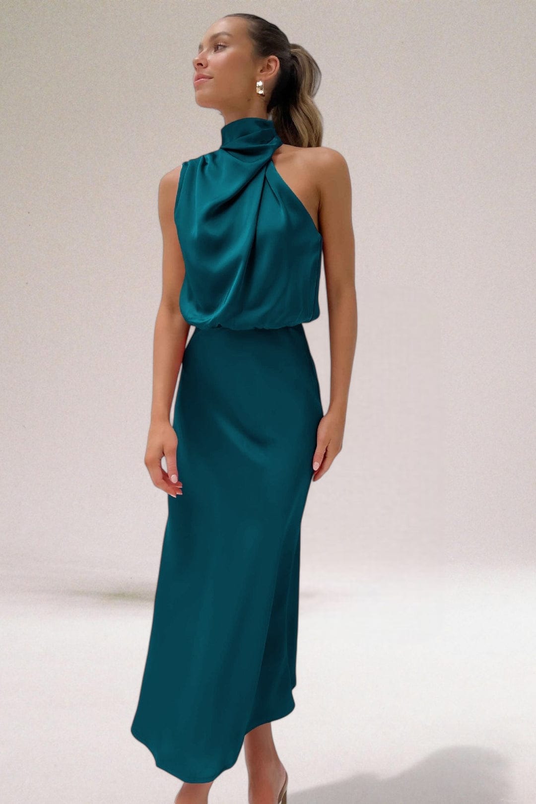 Teal halter midi dress with high neck drape and sleeveless cocktail style