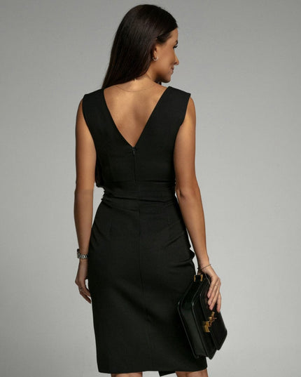 Back view of black pleated V neck midi dress with sleeveless cut and tailored fit