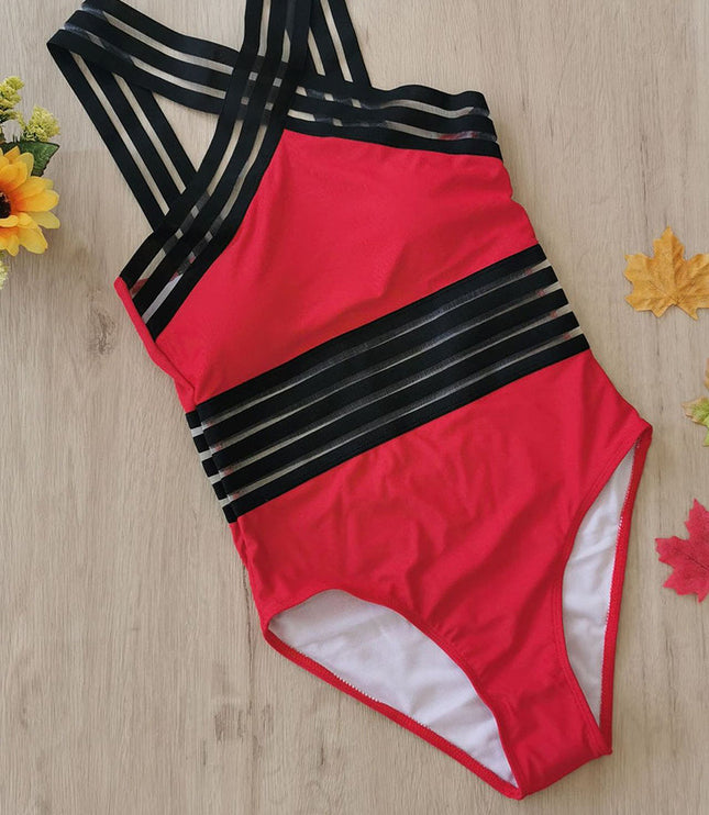 Red one piece swimsuit with black criss cross halter straps and sheer striped bands