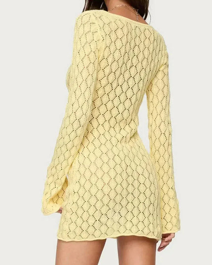 Back view of yellow crochet mini dress with open-knit pattern and long sleeves
