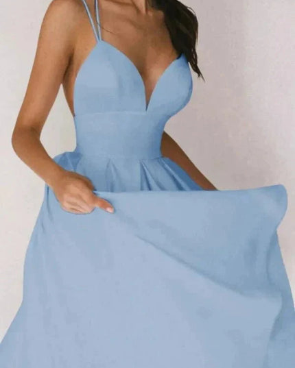 Light blue V neck open back midi dress with thin straps and voluminous skirt