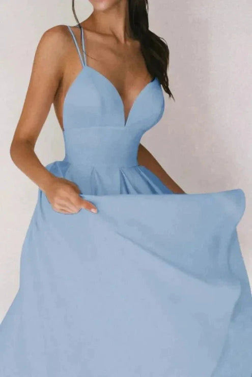 Light blue V neck open back midi dress with thin straps and voluminous skirt
