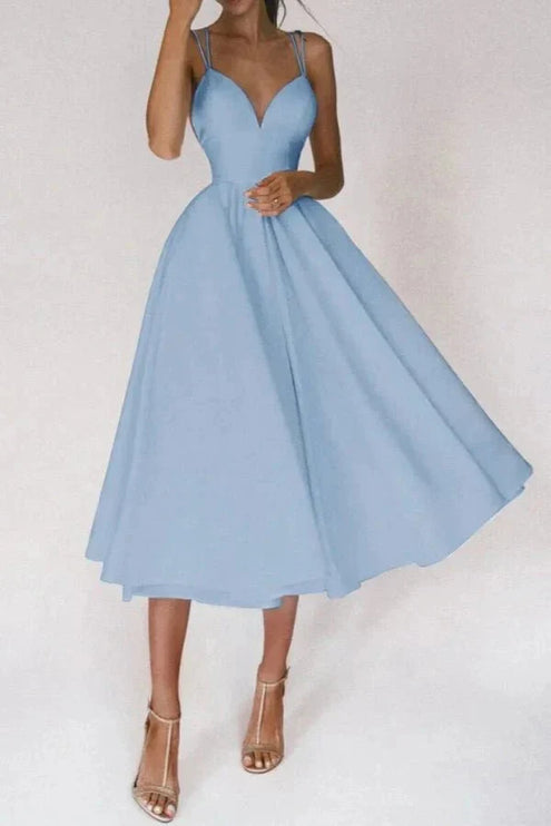 Front view of light blue wedding guest midi dress with V neck and full skirt