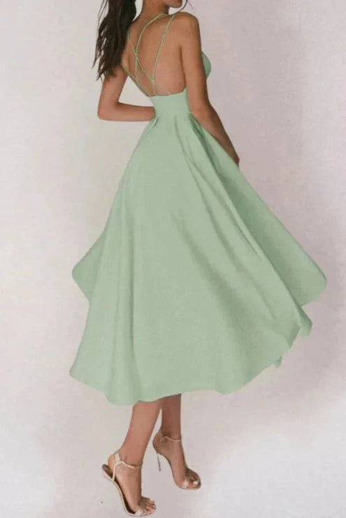 Mint green V neck open back midi dress with thin straps and flared skirt