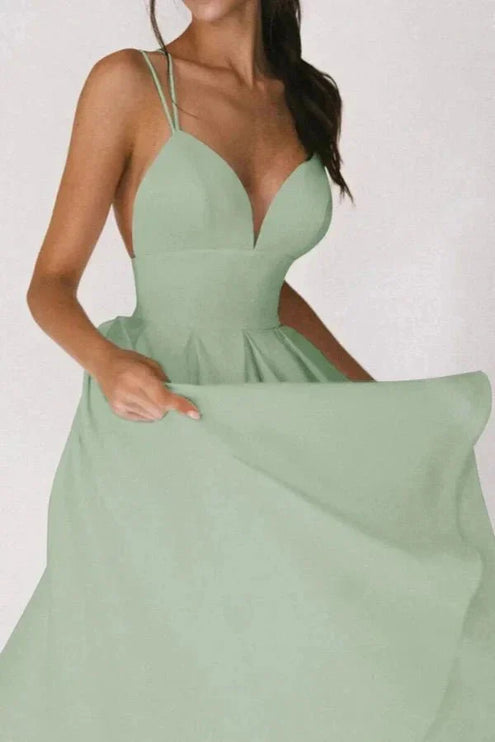 Front view of mint green wedding guest midi dress with deep V neck and full skirt