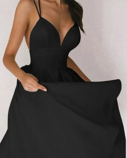 Black V neck open back midi dress with thin straps and full skirt for wedding guest