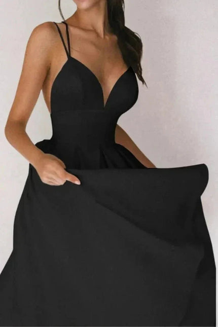 Black V neck open back midi dress with thin straps and full skirt for wedding guest
