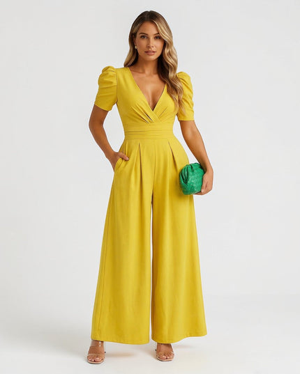 Yellow wide leg jumpsuit with puff sleeves, deep V-neck, and pleated waist