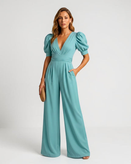 Teal wide leg jumpsuit with puff sleeves, deep V-neck, and gathered waist