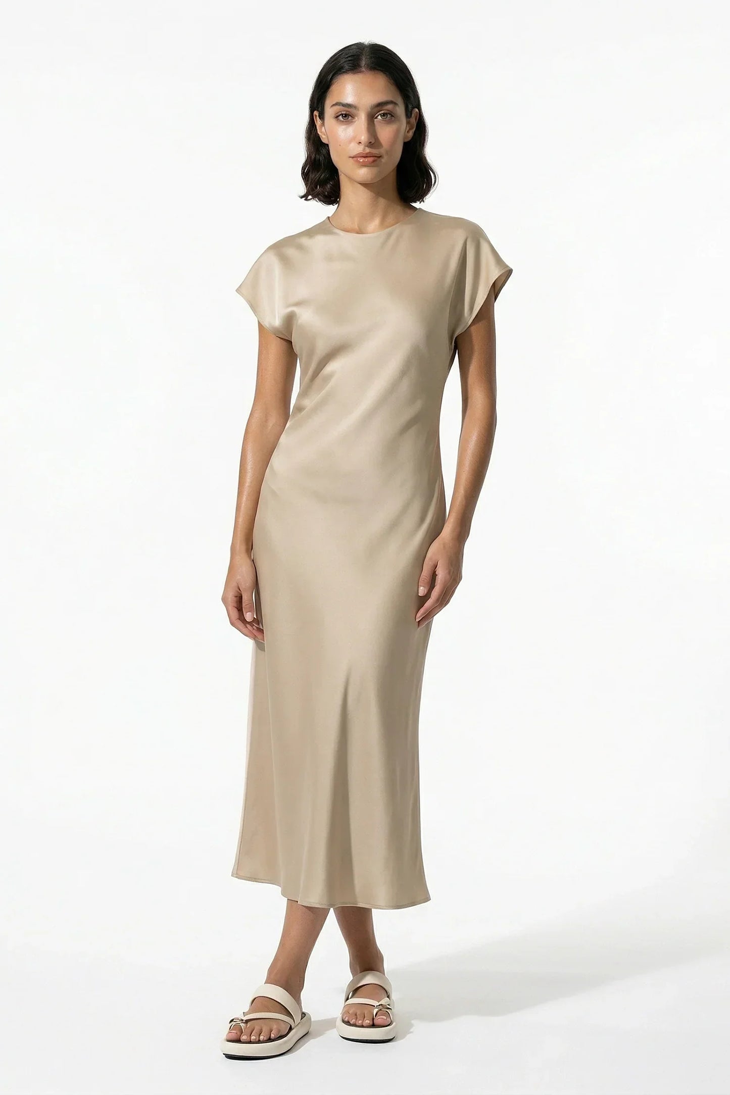 Cream satin midi dress styled with cap sleeves and a clean minimalist fit