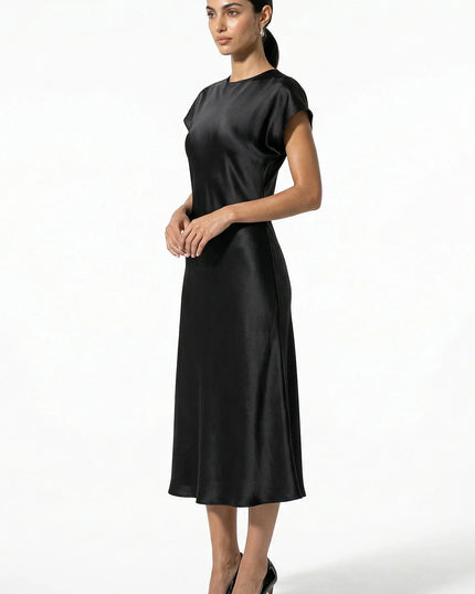 Side view of black satin midi dress with cap sleeves and midi length