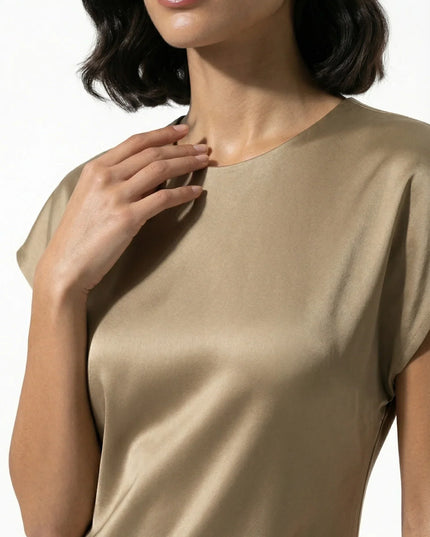 Close-up of taupe satin midi dress neckline and smooth glossy fabric