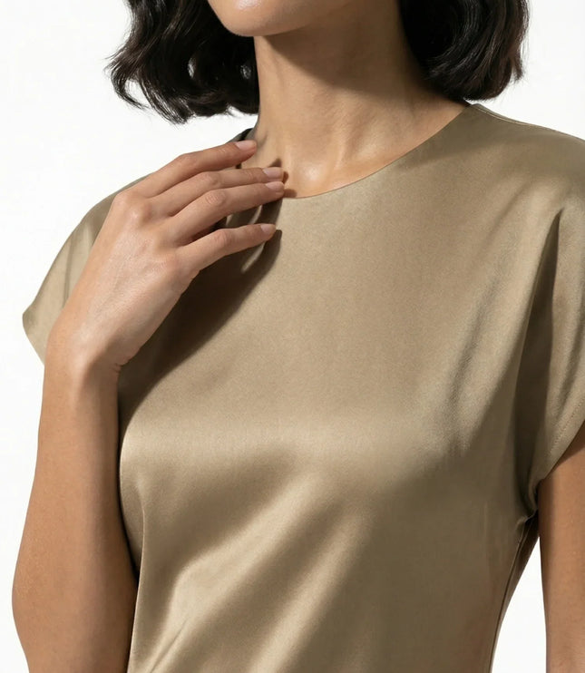 Close-up of taupe satin midi dress neckline and smooth glossy fabric