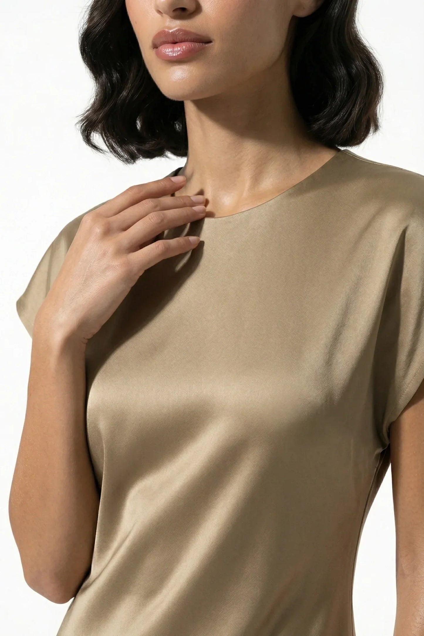 Close-up of taupe satin midi dress neckline and smooth glossy fabric