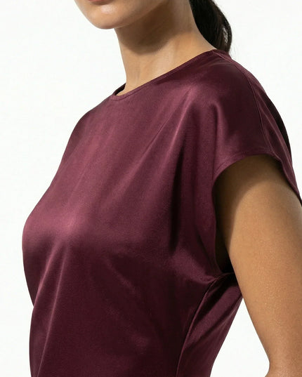 Close-up of burgundy satin midi dress showing sheen and cap sleeve detail