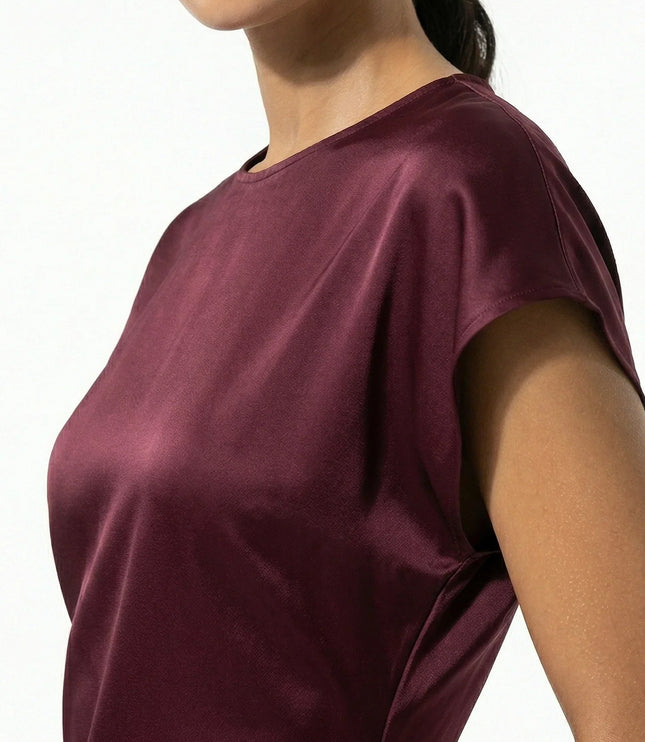 Close-up of burgundy satin midi dress showing sheen and cap sleeve detail